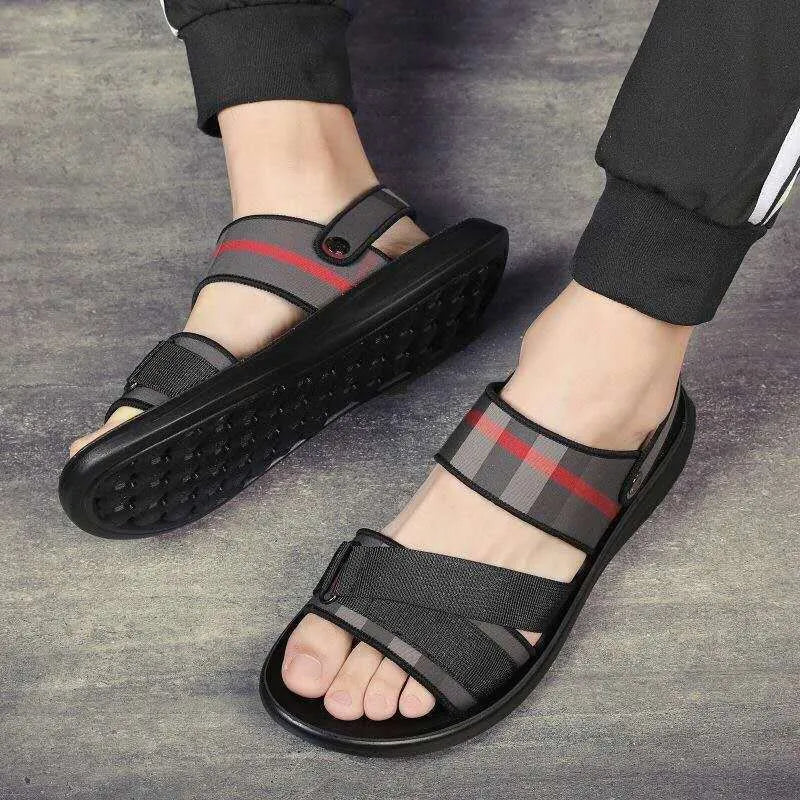 Pair of youth leisure sandals with a sporty design, featuring a lycra fabric upper and a polyurethane sole.