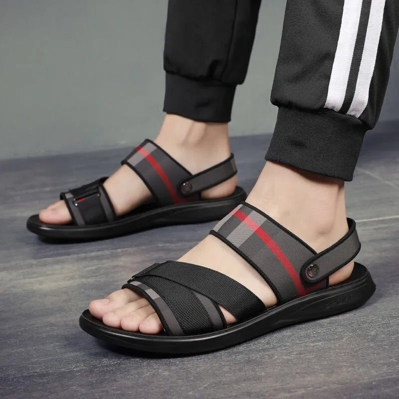 Pair of youth leisure sandals with a sporty design, featuring a lycra fabric upper and a polyurethane sole.