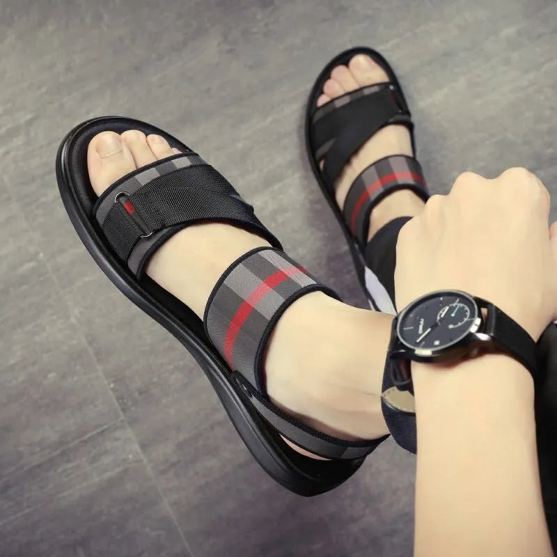 Pair of youth leisure sandals with a sporty design, featuring a lycra fabric upper and a polyurethane sole.