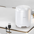 Small black or white wireless Bluetooth speaker with card reader slot measuring 90x73x73mm
