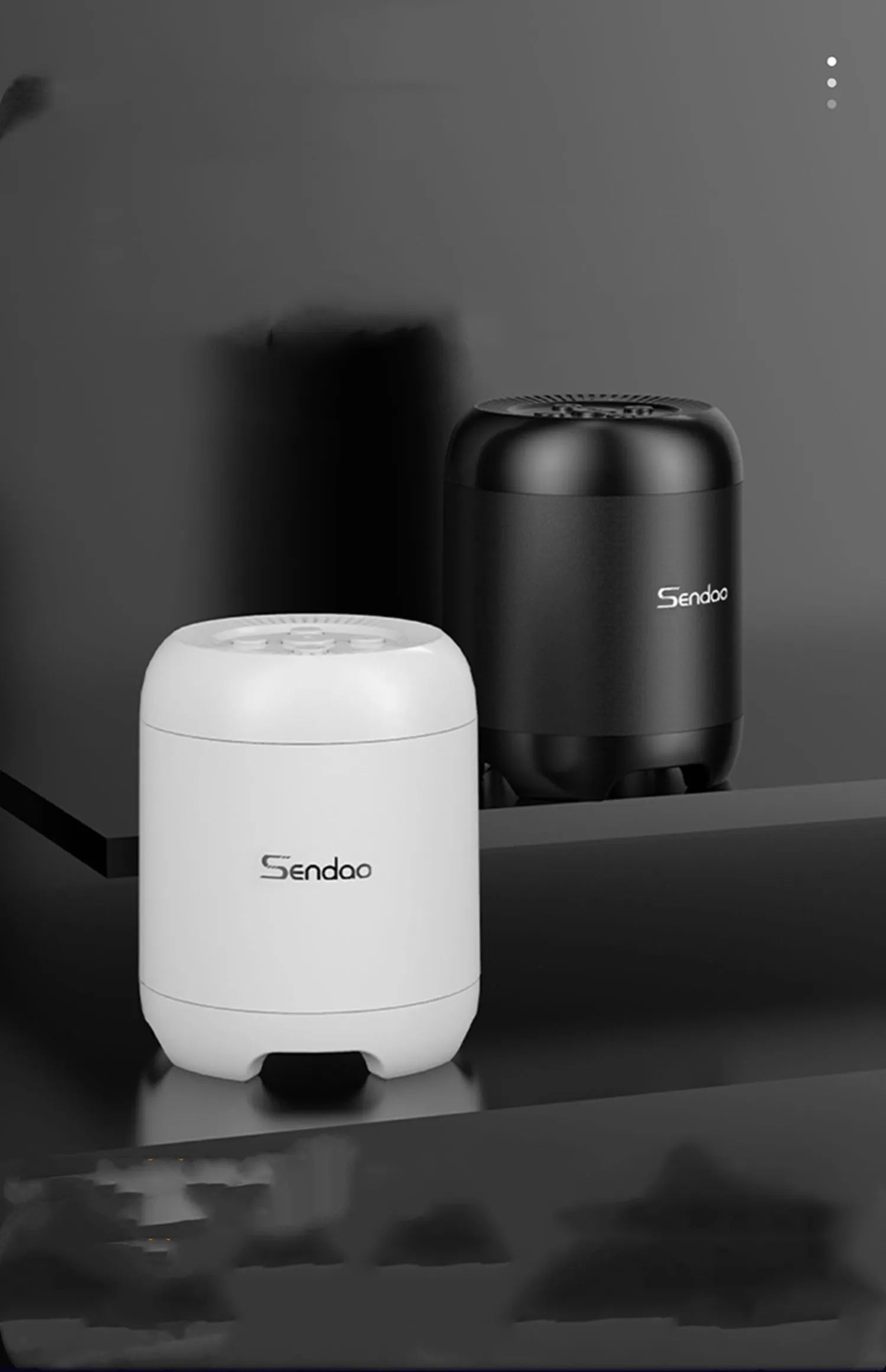 Small black or white wireless Bluetooth speaker with card reader slot measuring 90x73x73mm