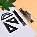 Plastic fraction teaching aids set with magnetic blocks, discs, transparent films, and rulers on a base.