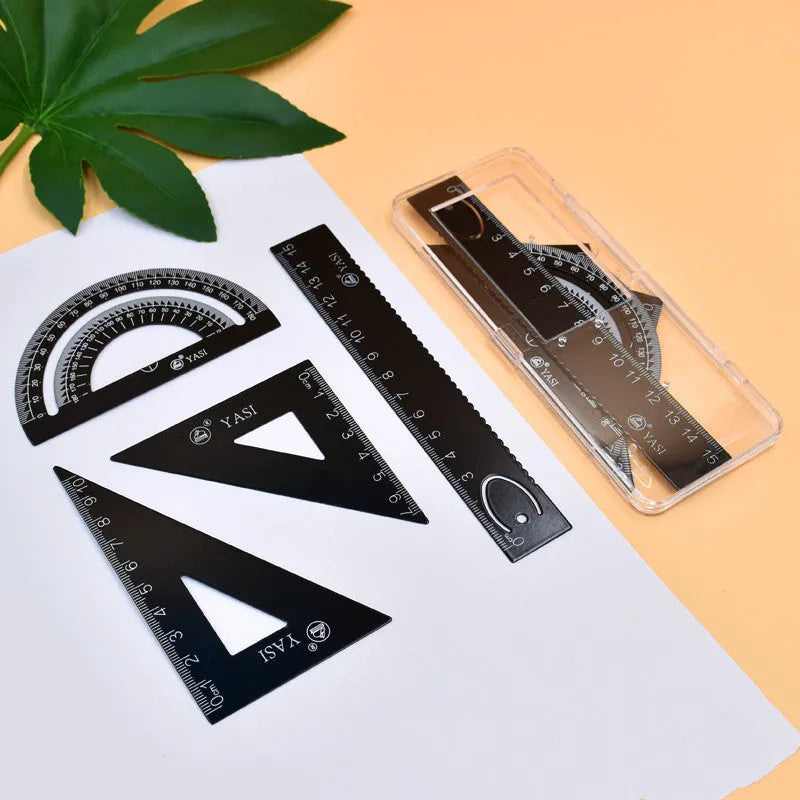 Plastic fraction teaching aids set with magnetic blocks, discs, transparent films, and rulers on a base.