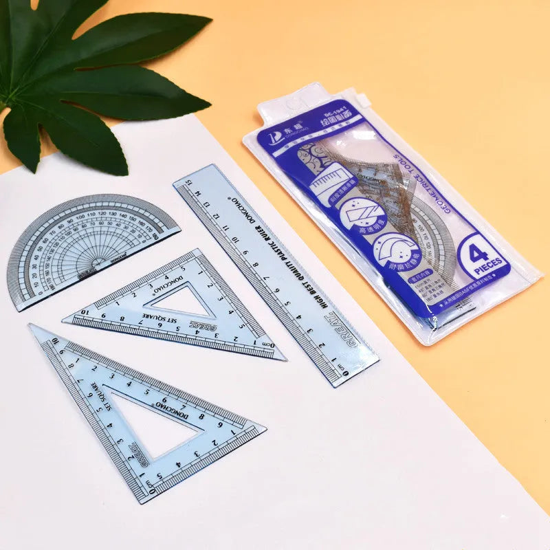 Plastic fraction teaching aids set with magnetic blocks, discs, transparent films, and rulers on a base.