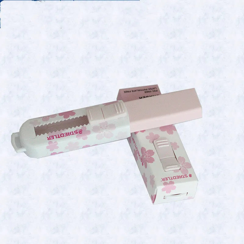 Square pink rubber push-pull tool with replaceable core measuring 86x26x22mm for student use