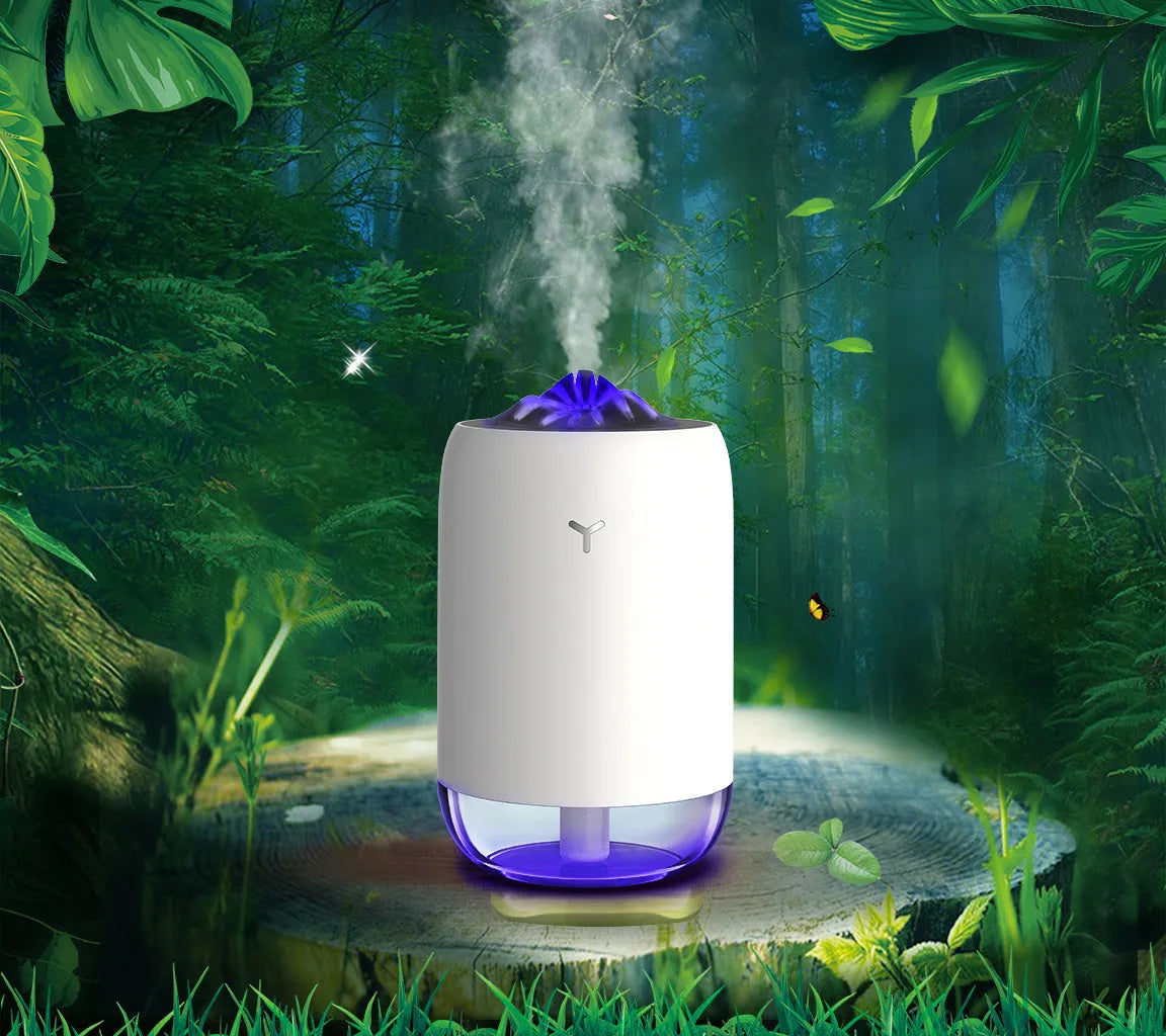 White Magic Flame columnar humidifier with USB cable on a desk