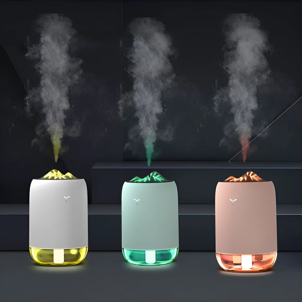 White Magic Flame columnar humidifier with USB cable on a desk