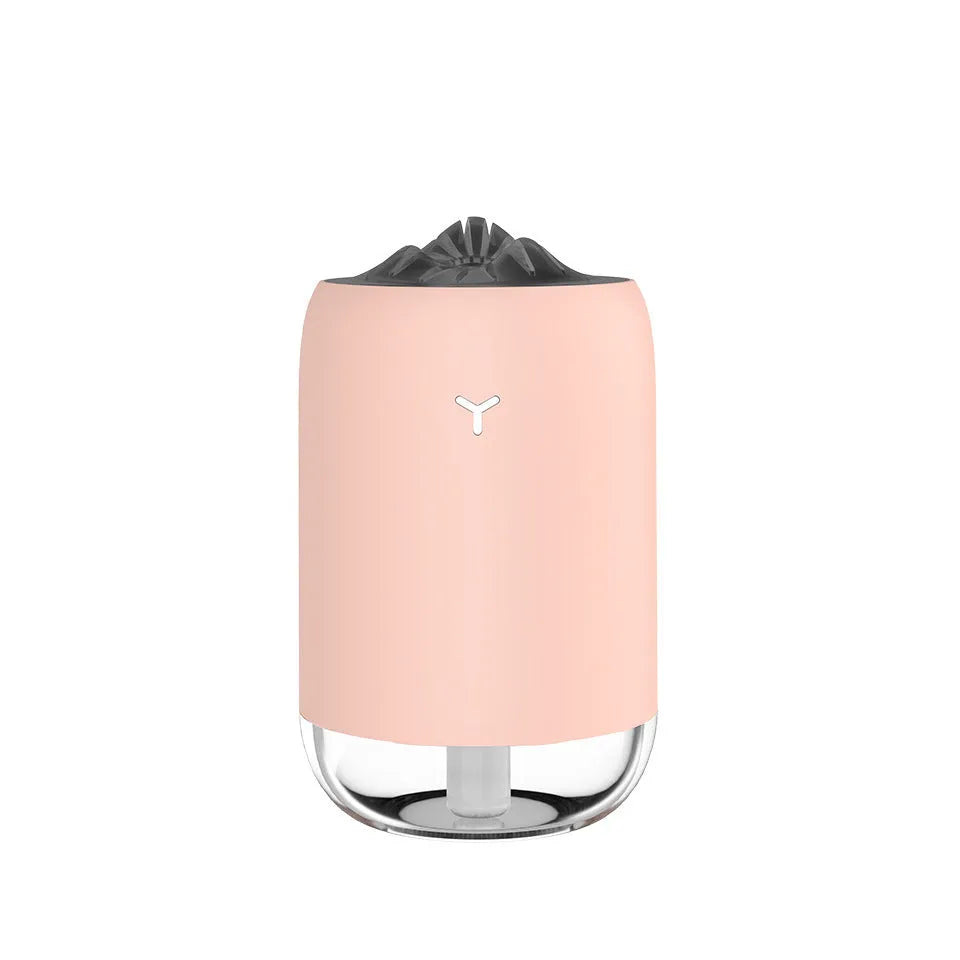 White Magic Flame columnar humidifier with USB cable on a desk