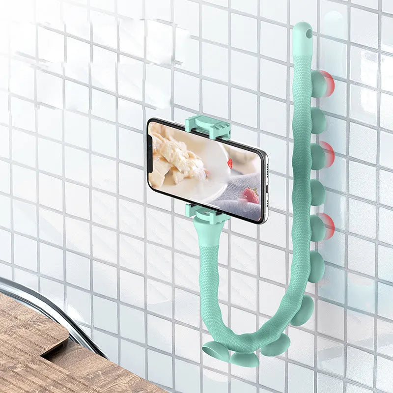 Flexible rubber phone holder with suction cup mount showing 360 degree rotation capability