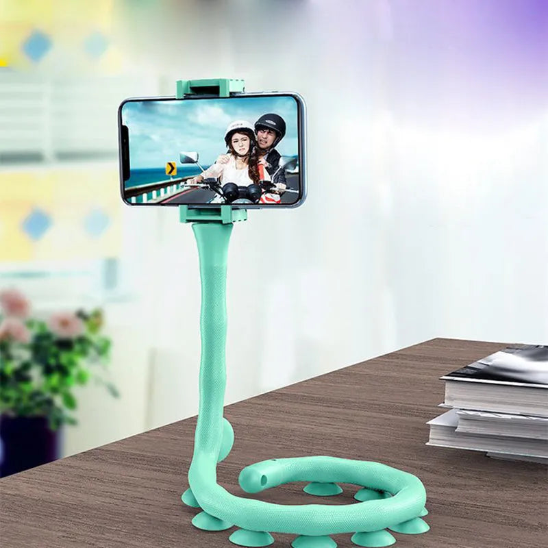 Flexible rubber phone holder with suction cup mount showing 360 degree rotation capability