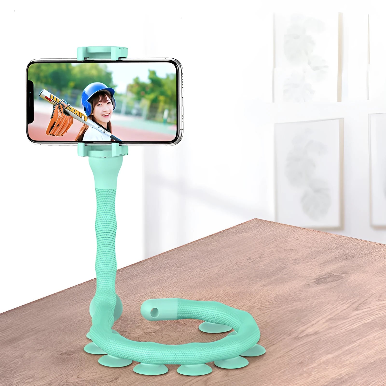 Flexible rubber phone holder with suction cup mount showing 360 degree rotation capability