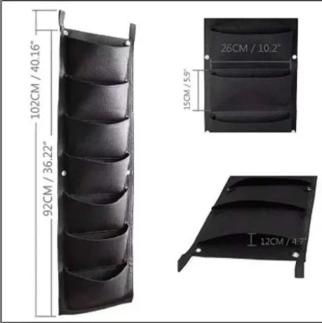 Vertical felt wall garden planter with multiple planting pockets hanging on outdoor wall