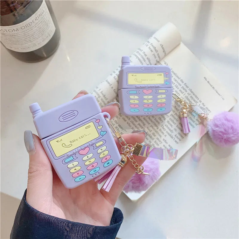Purple silicone AirPods case with fur ball pendant, clamshell design for AirPods Pro and AirPods 1/2 models