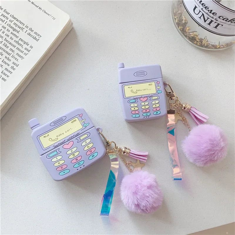 Purple silicone AirPods case with fur ball pendant, clamshell design for AirPods Pro and AirPods 1/2 models