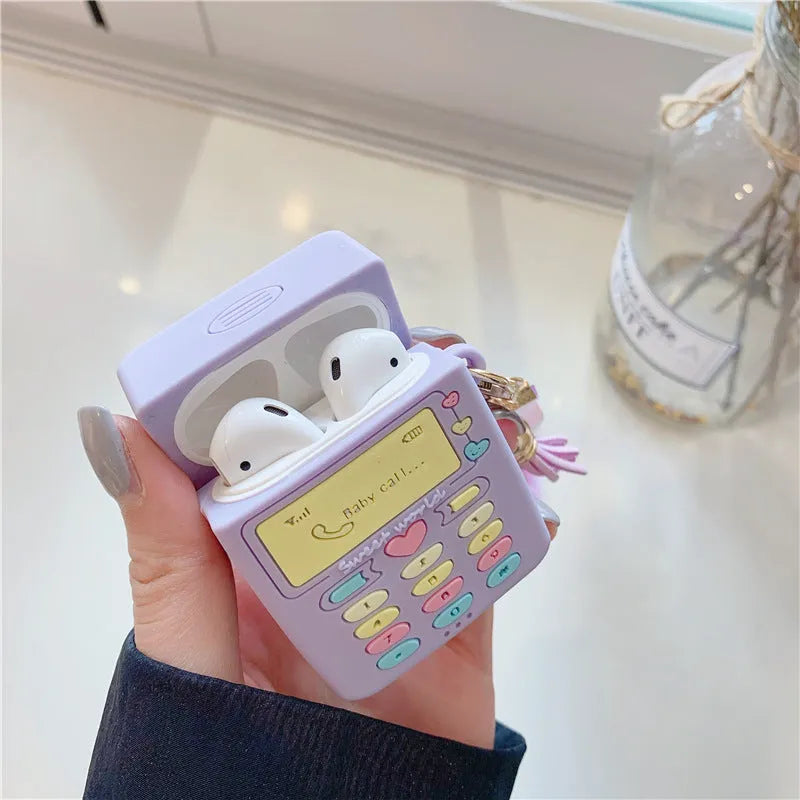 Purple silicone AirPods case with fur ball pendant, clamshell design for AirPods Pro and AirPods 1/2 models