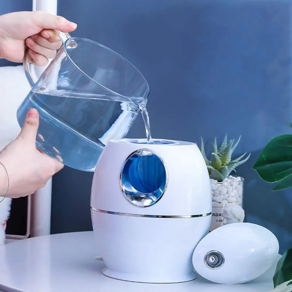 White rounded USB aromatherapy humidifier with water tank and mist output