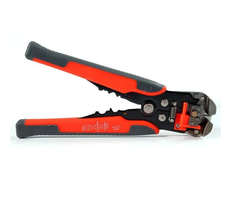 Yellow automatic 3-in-1 wire stripper and crimper tool for electrical cables on a workbench.