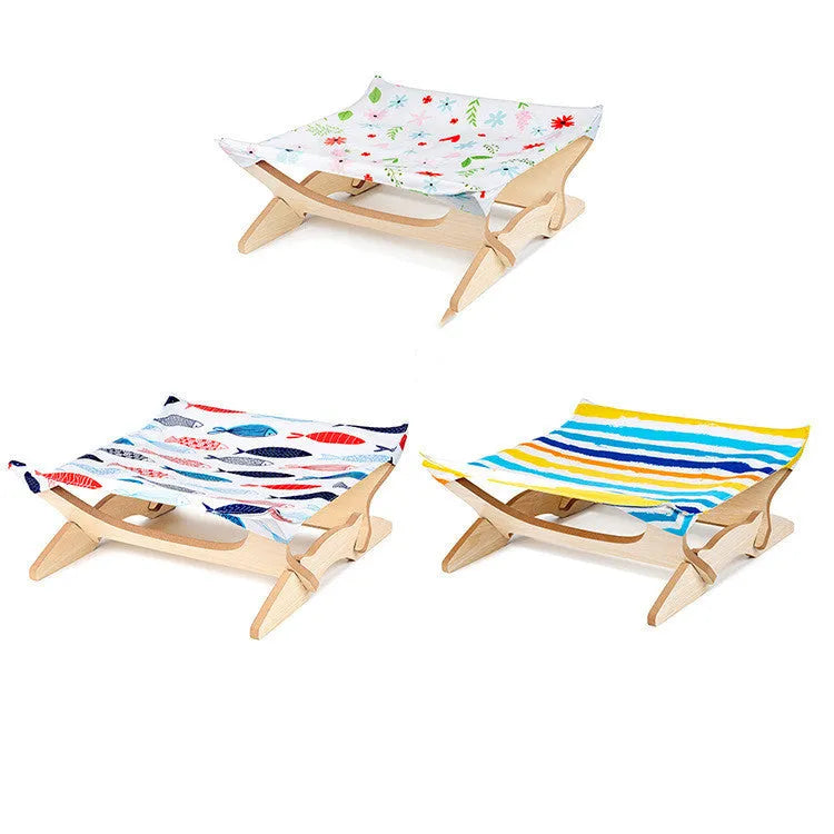 Wooden cat hammock with a striped passion stripe cloth cover on a wooden frame, sized for indoor cats