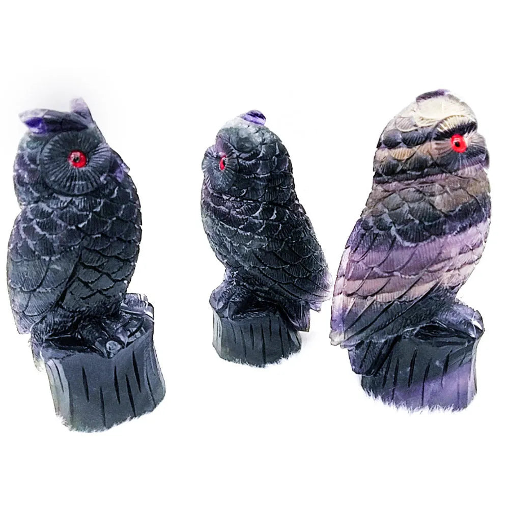 Purple fluorite carved owl ornament approximately 4 inches tall on display surface