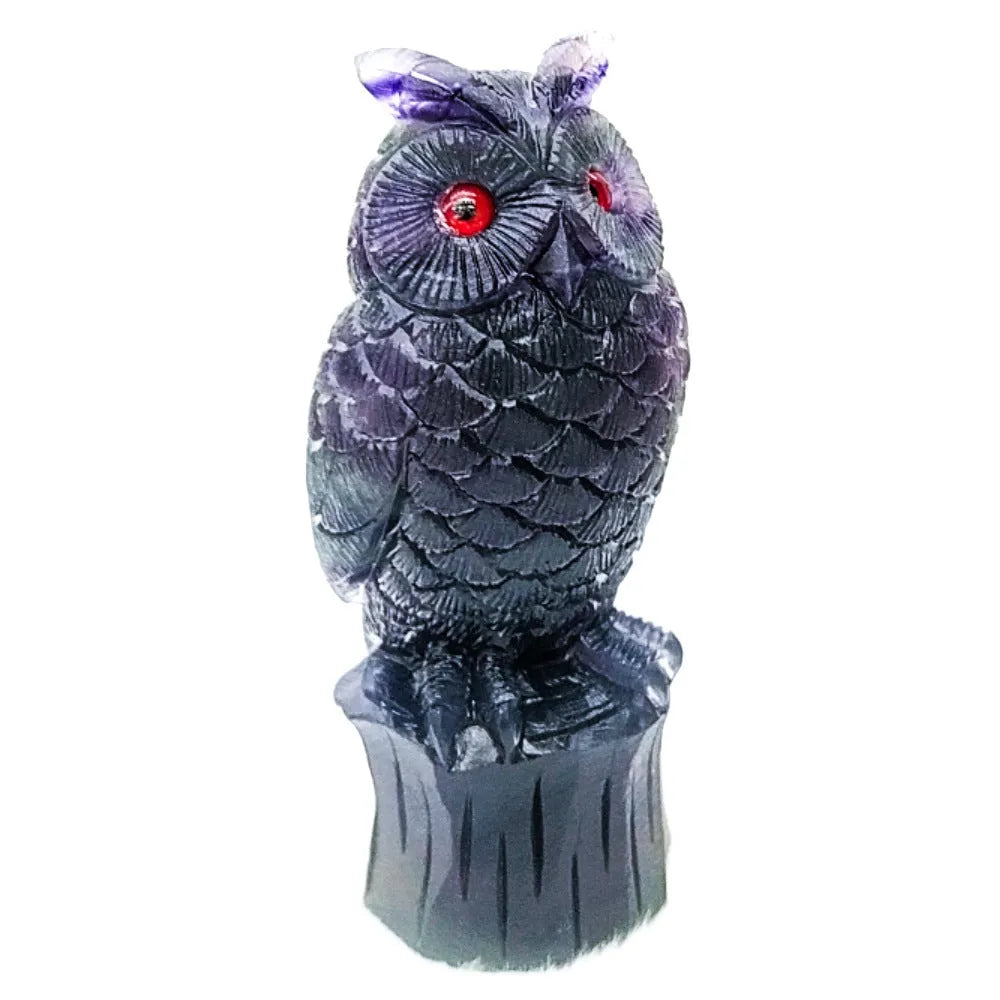 Purple fluorite carved owl ornament approximately 4 inches tall on display surface