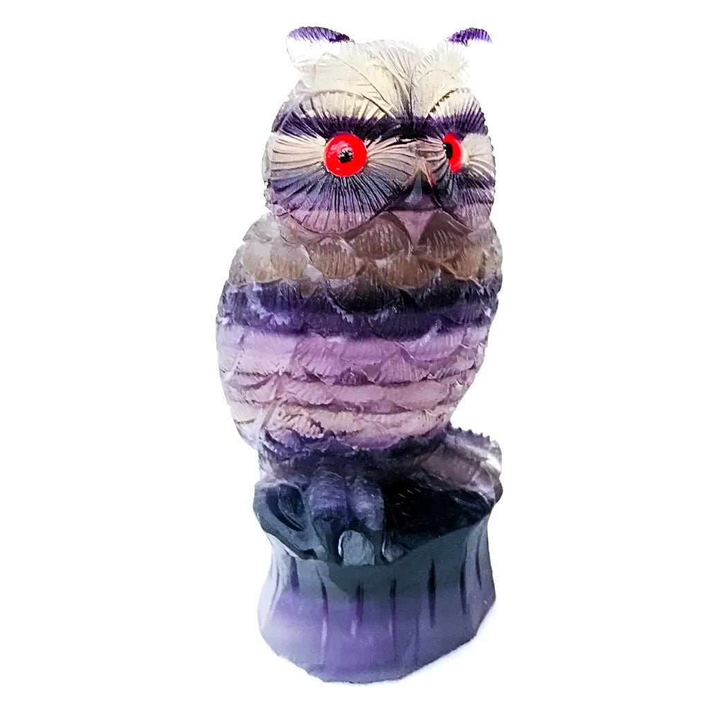 Purple fluorite carved owl ornament approximately 4 inches tall on display surface