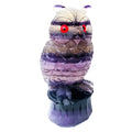 Purple fluorite carved owl ornament approximately 4 inches tall on display surface
