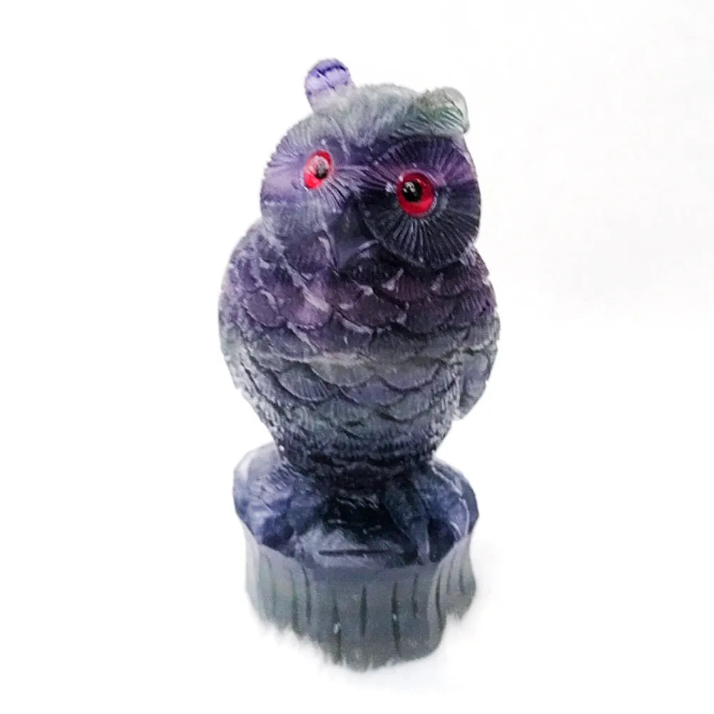 Purple fluorite carved owl ornament approximately 4 inches tall on display surface