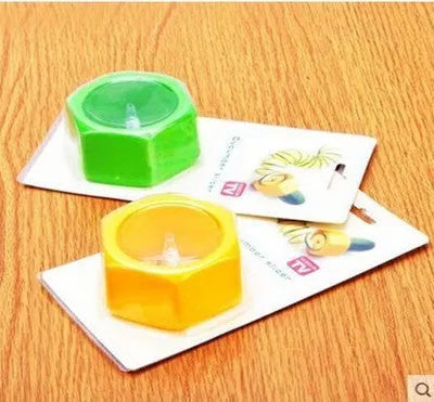 Yellow and green plastic spiral vegetable cutter for kitchen use.