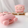Silicone AirPods case cover with cartoon pig design in pink colour showing flip closure and keychain hook