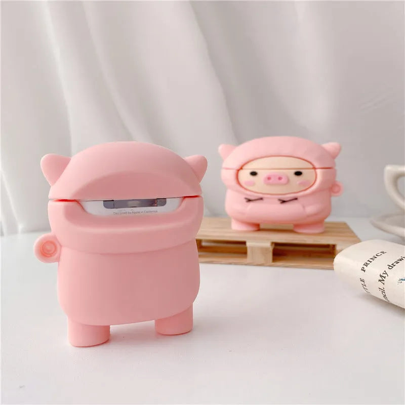 Silicone AirPods case cover with cartoon pig design in pink colour showing flip closure and keychain hook