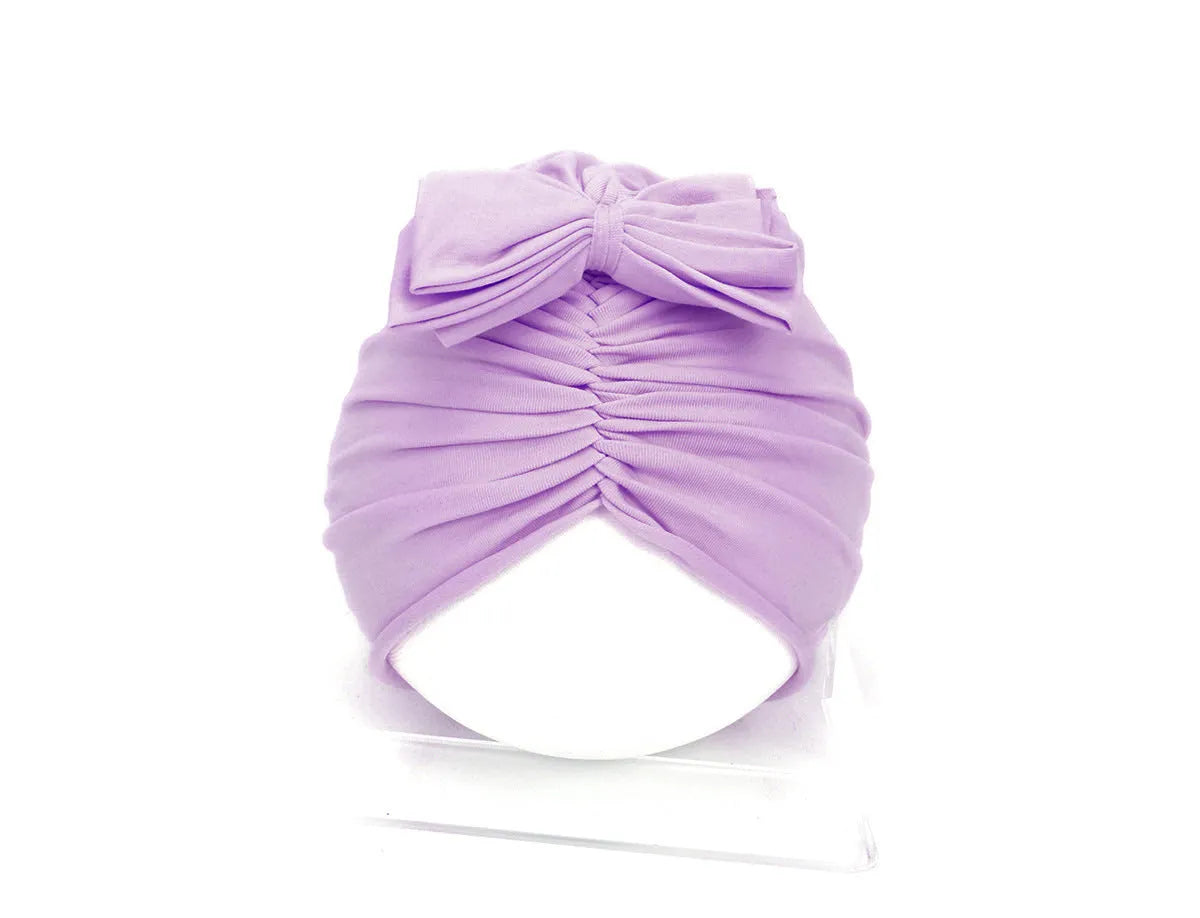 Soft knitted acrylic baby girl turban hat in various colours fitting 0-28 months