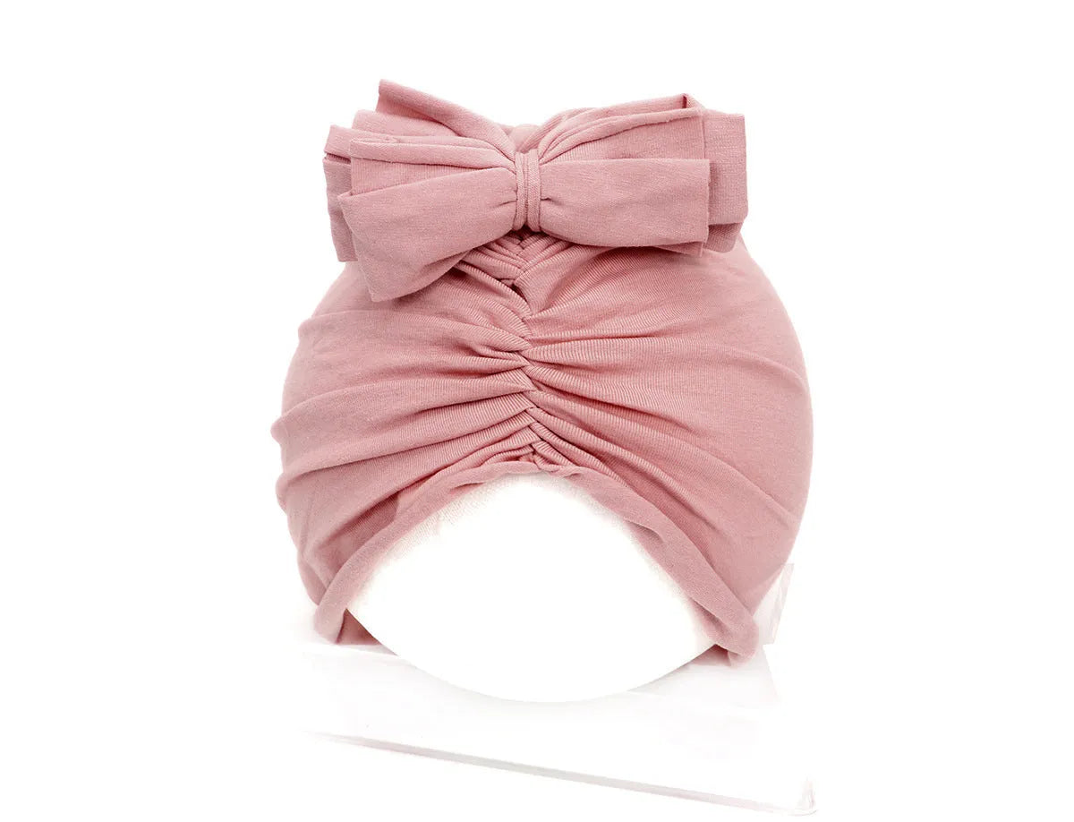 Soft knitted acrylic baby girl turban hat in various colours fitting 0-28 months