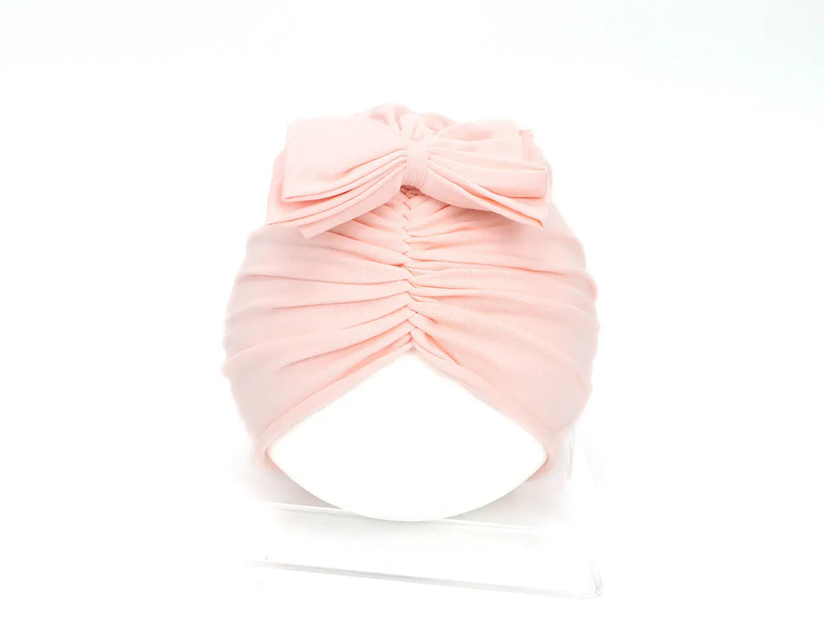 Soft knitted acrylic baby girl turban hat in various colours fitting 0-28 months