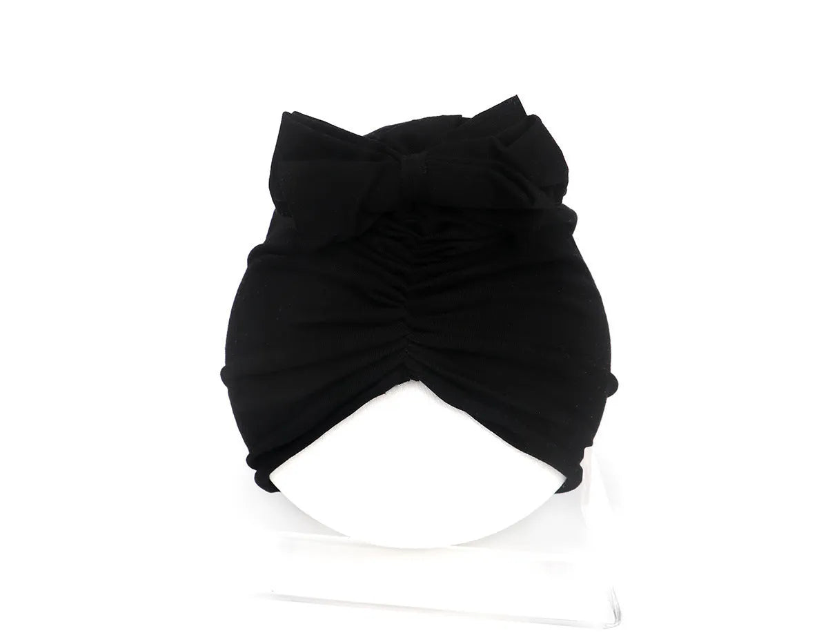 Soft knitted acrylic baby girl turban hat in various colours fitting 0-28 months