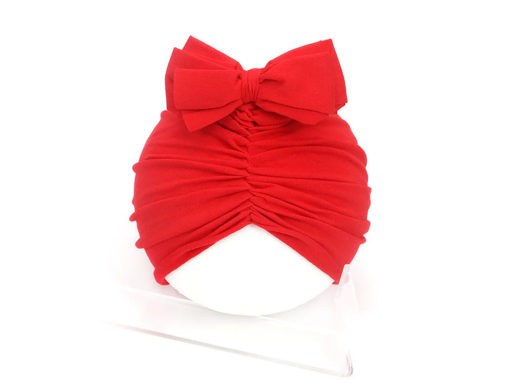 Soft knitted acrylic baby girl turban hat in various colours fitting 0-28 months
