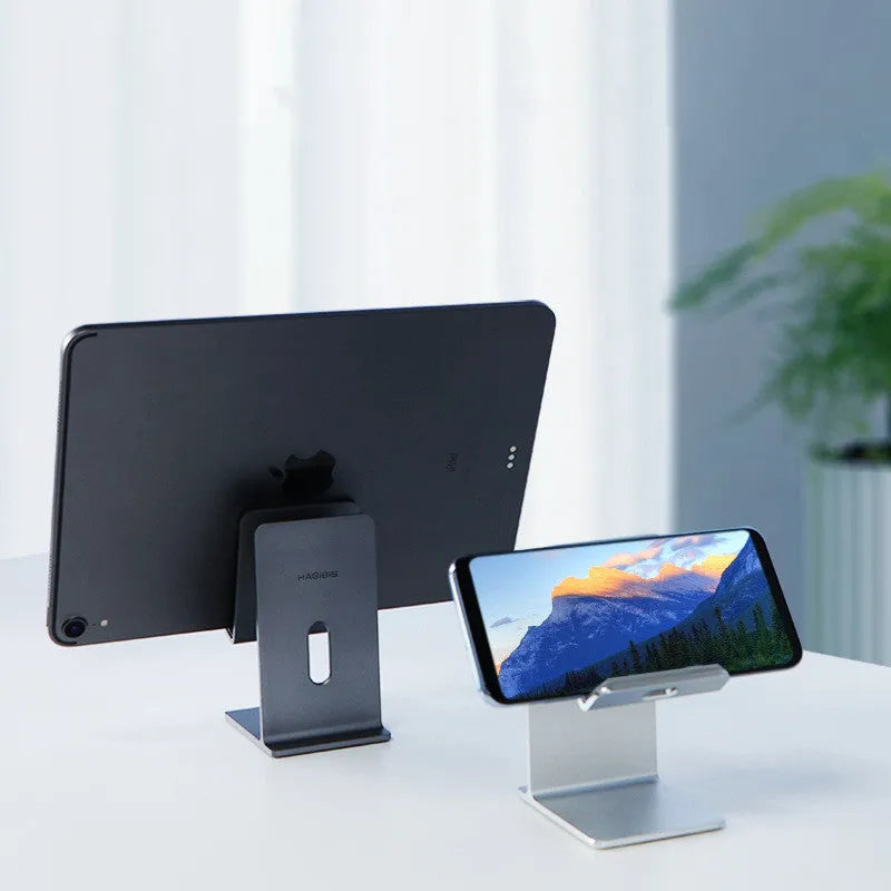 Alloy mobile phone holder in Dark Space Gray colour on a desktop
