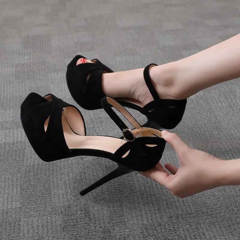 Black women's stiletto high heel sandals with fish mouth toe and platform sole.