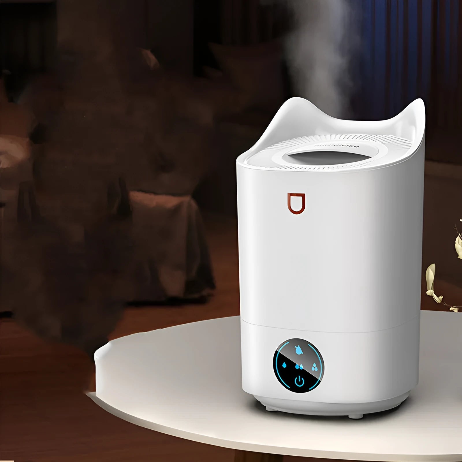 Coral pink USB humidifier with three fog outlets on white surface