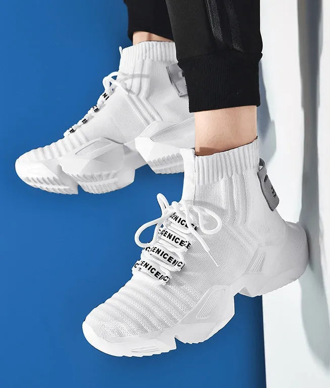 Men's black and white casual sports shoes with mesh lining, shown in large sizes.