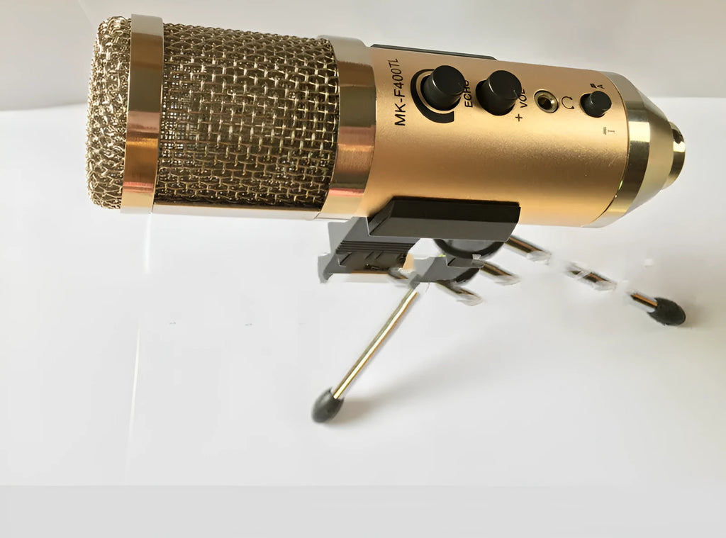 Gold USB-C condenser microphone on a black desk stand
