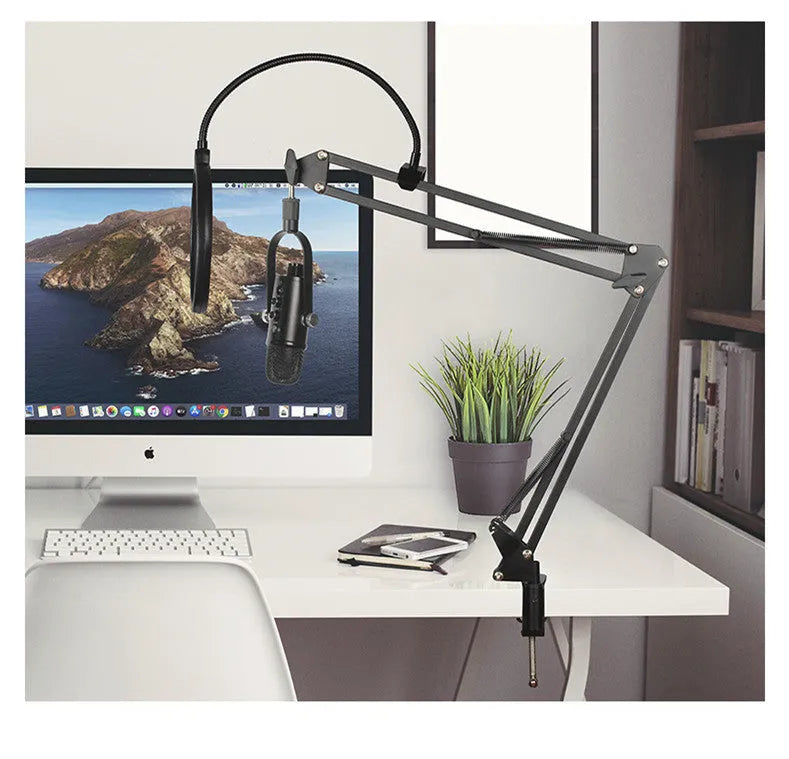 Black USB condenser microphone on a metal stand with a foam wind filter, for desktop streaming and recording.