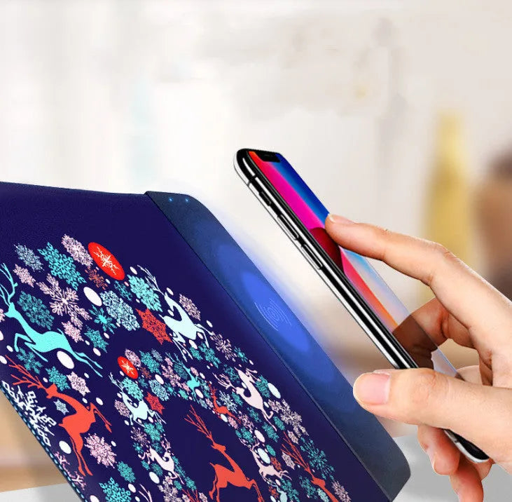 Cute cartoon wireless charging mouse pad with RGB lights on a desk