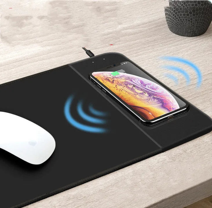 Cute cartoon wireless charging mouse pad with RGB lights on a desk