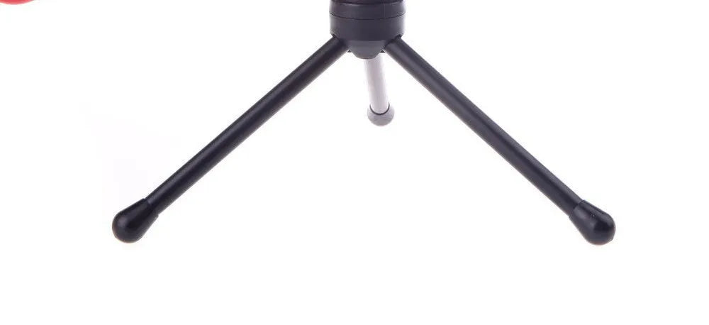 Black wired PC microphone with a metal clip-on holder and a long cable for desktop use.