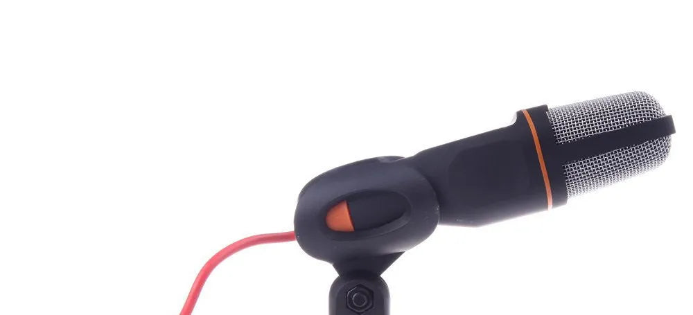 Black wired PC microphone with a metal clip-on holder and a long cable for desktop use.