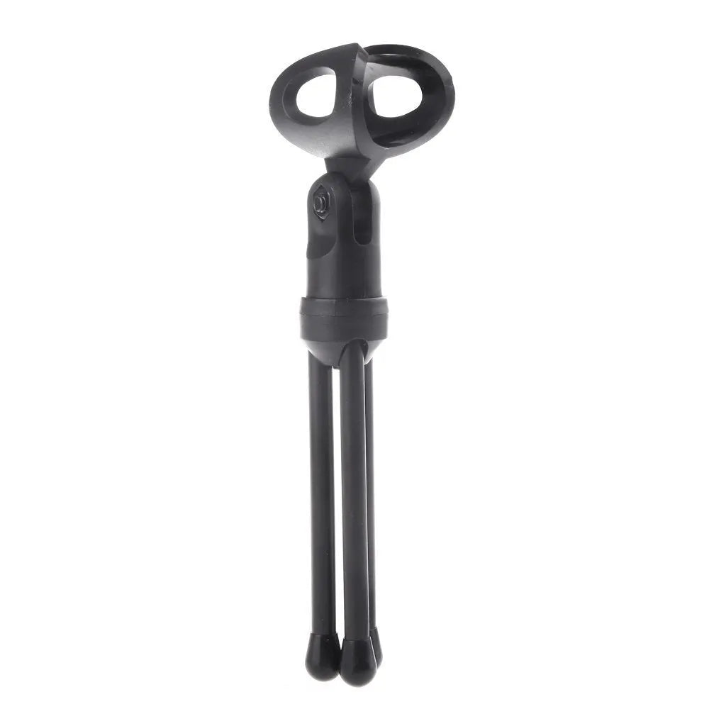 Black wired PC microphone with a metal clip-on holder and a long cable for desktop use.