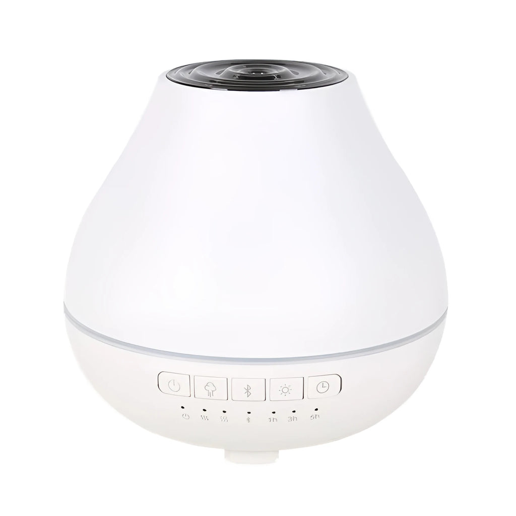 Round white Bluetooth humidifier and essential oil diffuser with night light on a wooden surface.