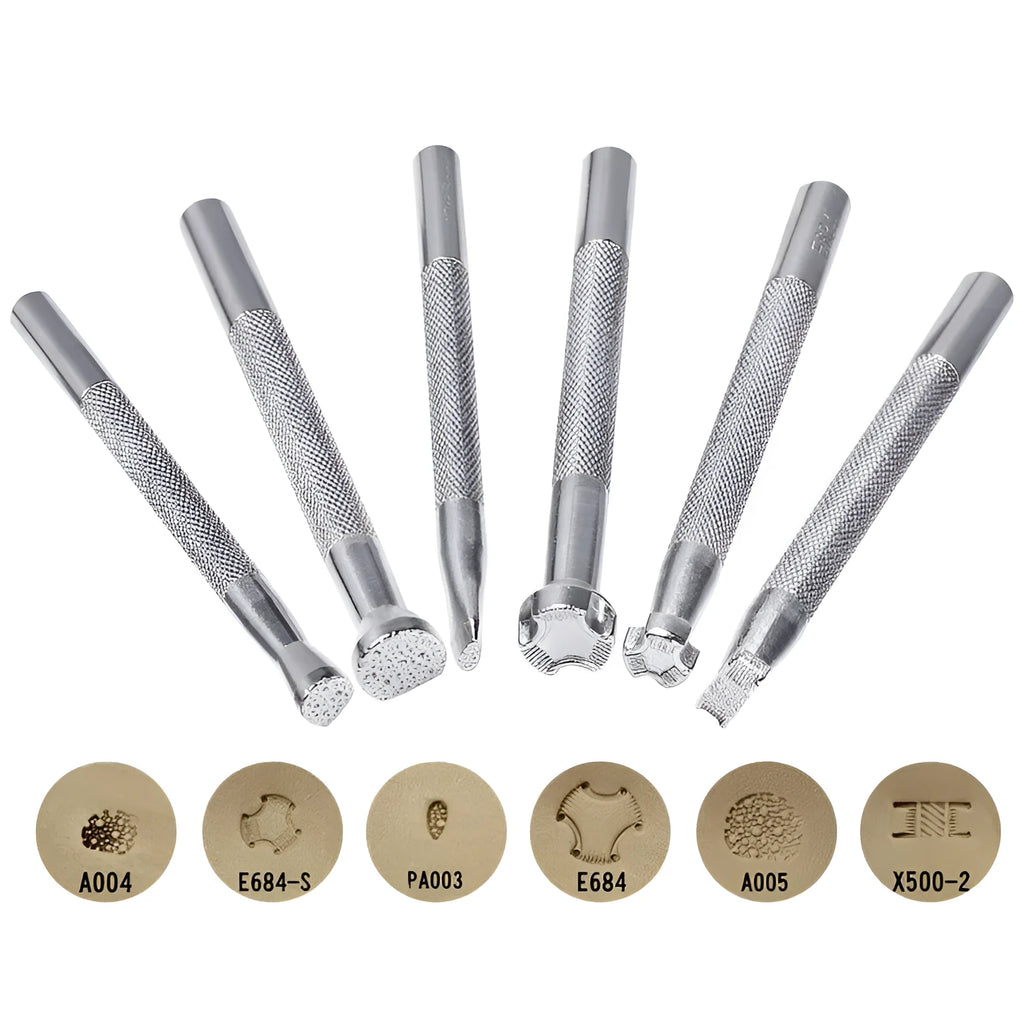 Set of six alloy leather carving printing sticks arranged on a workbench, tools for stamping and embossing