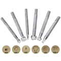 Set of six alloy leather carving printing sticks arranged on a workbench, tools for stamping and embossing
