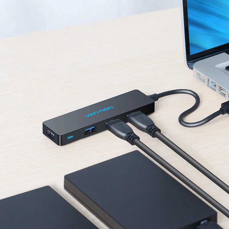 Black USB 3.0 four-port hub with short cable and nickel-plated connectors